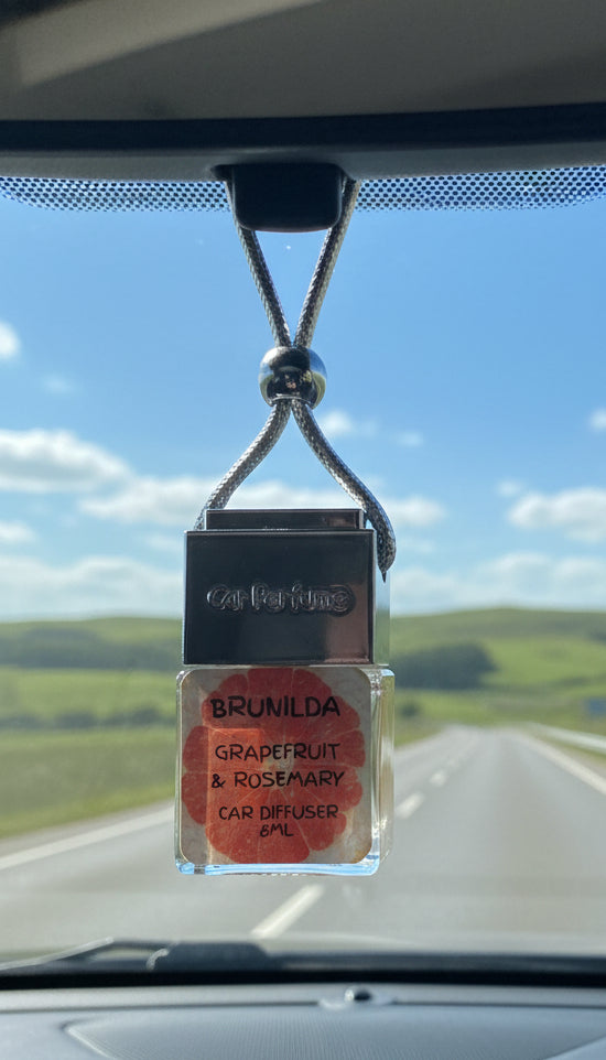 Car perfume diffuser with 'Brunilda' label on a white background